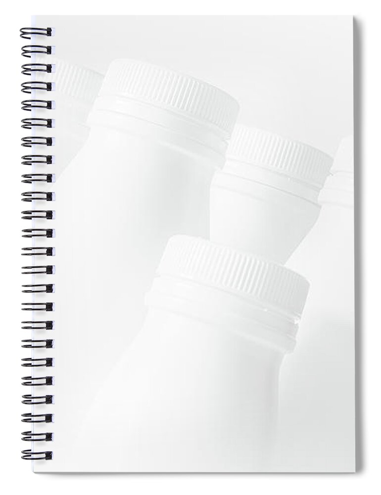White Spiral Notebook featuring the photograph White Trash - recycled bottles artwork 0010 by Simon Bratt