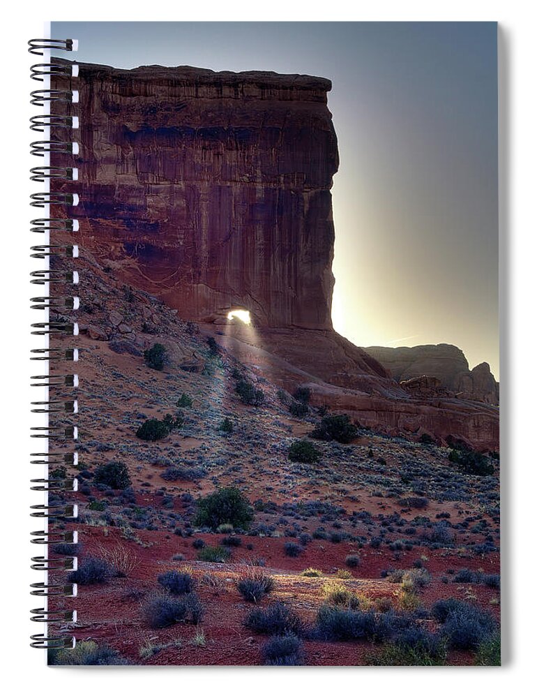  Park Avenue Spiral Notebook featuring the photograph Let your Light Shine Through - Sun beaming through portal in Sheep Rock at Arches National Park by Peter Herman