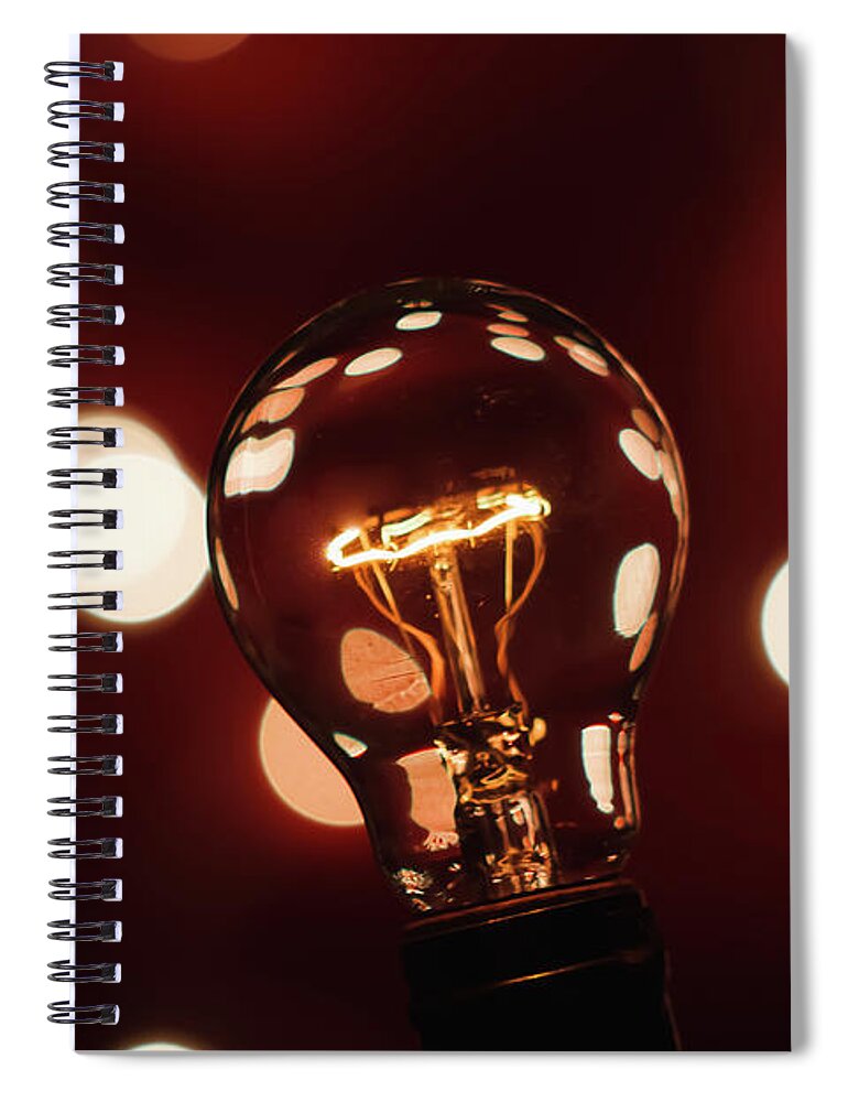 Light Bulb Spiral Notebook featuring the photograph Light Bulb Bokeh by Gary Geddes
