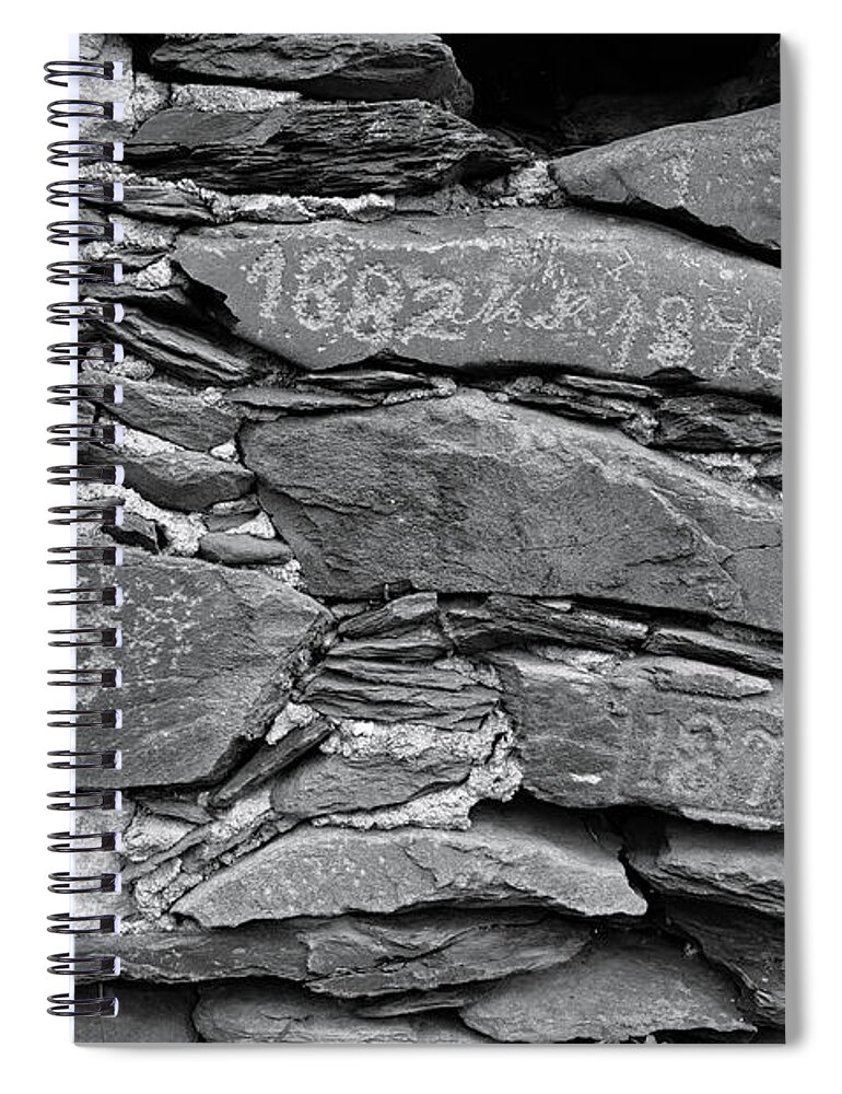 Stone Wall Spiral Notebook featuring the photograph Old schist wall with several dates from 19th century. Portugal by Angelo DeVal