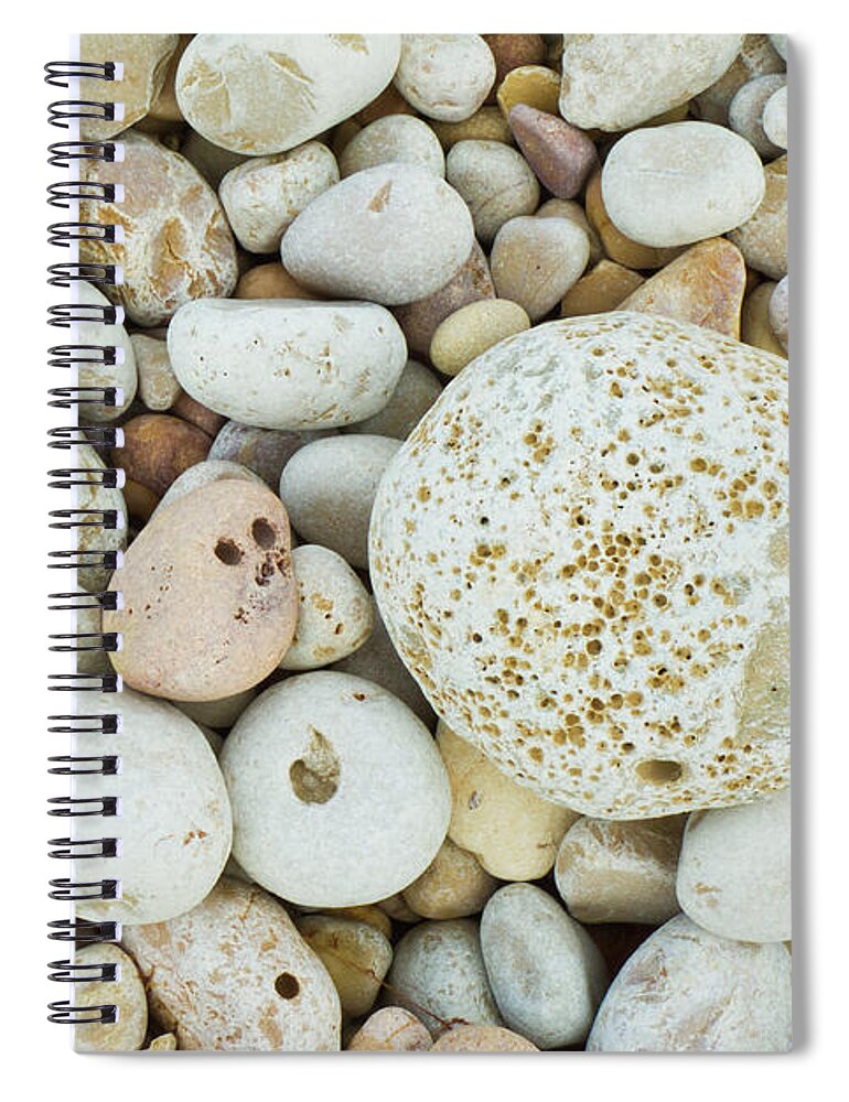 Pebbles Spiral Notebook featuring the photograph Pebbles on the beach by Neale And Judith Clark