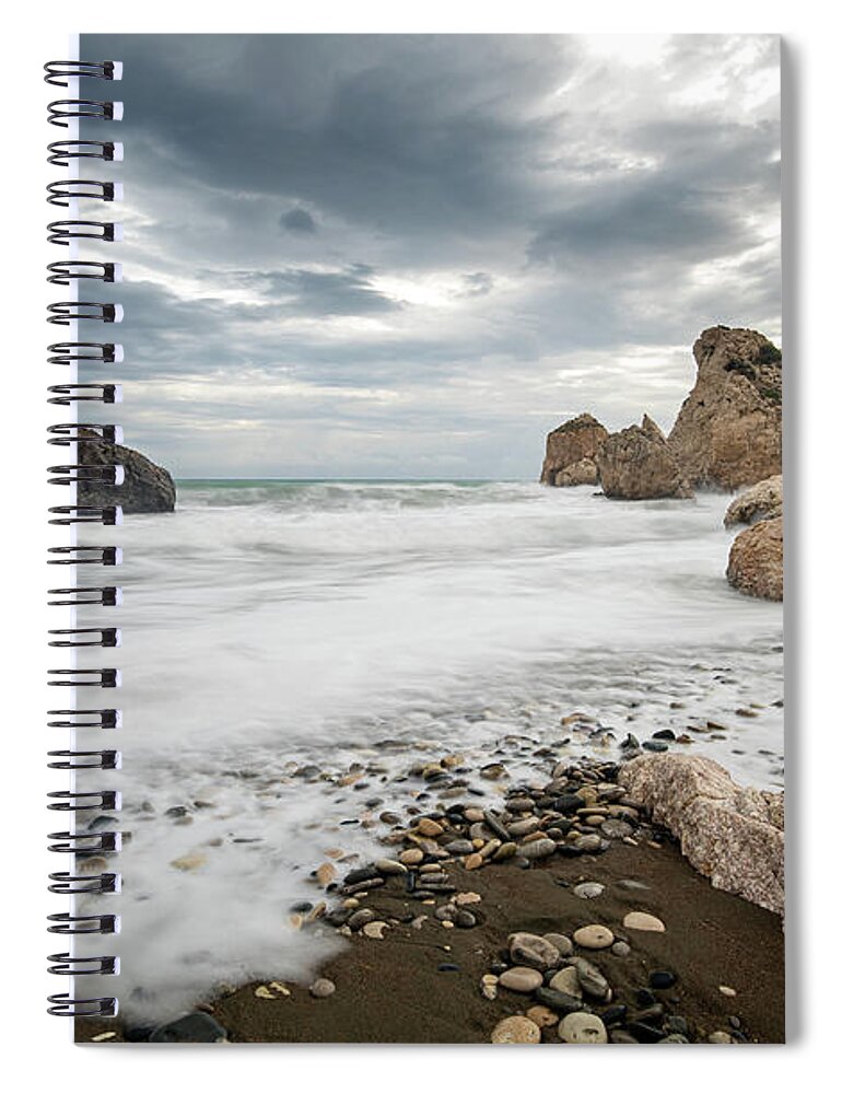 Seascape Spiral Notebook featuring the photograph Seascape with windy waves splashing at the rocky coastal area. by Michalakis Ppalis