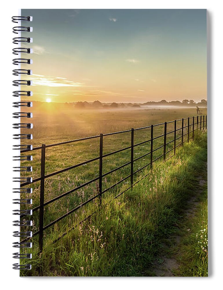 Norfolk Spiral Notebook featuring the photograph Sunrise over rural fields fences and track in Norfolk UK by Simon Bratt