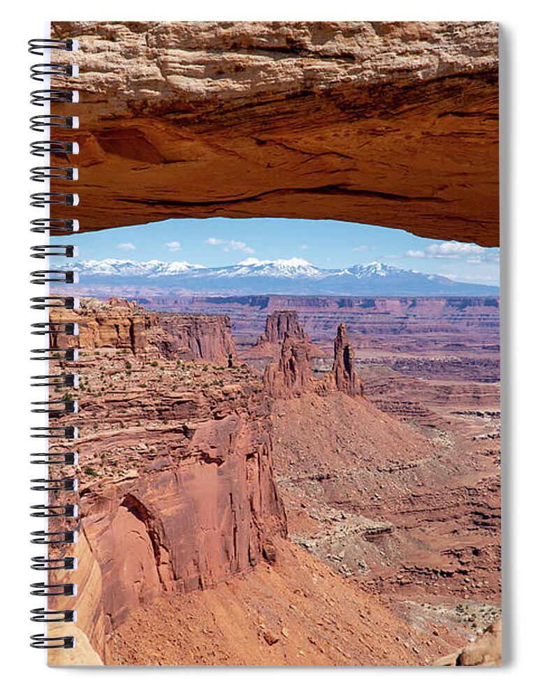 Canyonlands National Park Spiral Notebook featuring the photograph The Washerwoman Arch is framed by the Mesa Arch at Canyonlands N by William Kuta