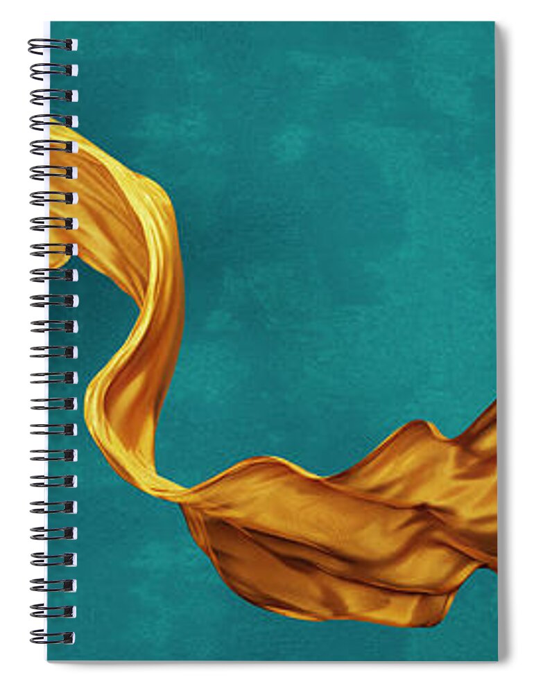 Yellow Spiral Notebook featuring the photograph Yellow silk fabric floating in front of blue background wall. Fl by Jelena Jovanovic