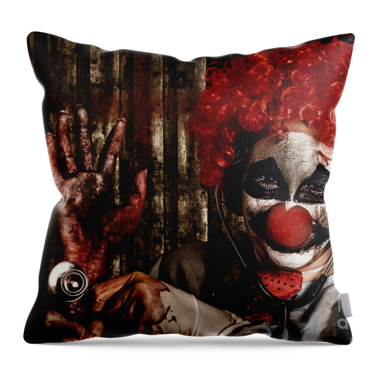 Clown Throw Pillow featuring the photograph Frightening clown doctor holding amputated hand #1 by Jorgo Photography