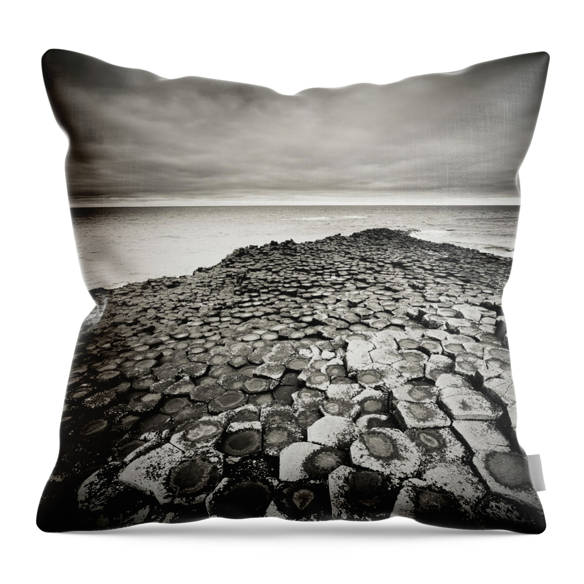 Water's Edge Throw Pillow featuring the photograph Giants Causeway On A Cloudy Day #2 by Mammuth