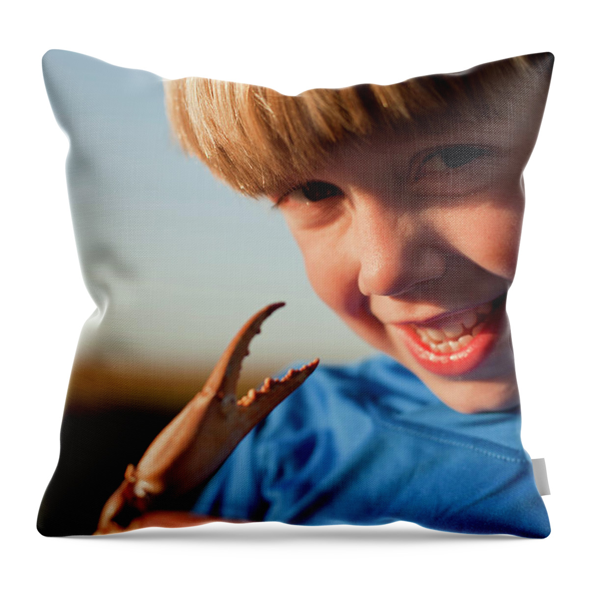 2-3 Years Throw Pillow featuring the photograph A Boy Plays With A Crab Claw by Logan Mock-Bunting