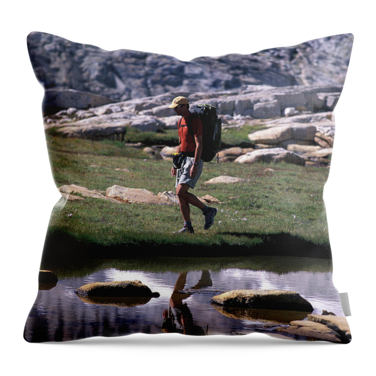 Adult Throw Pillow featuring the photograph A Hiker Walking Through An Alpine by Corey Rich