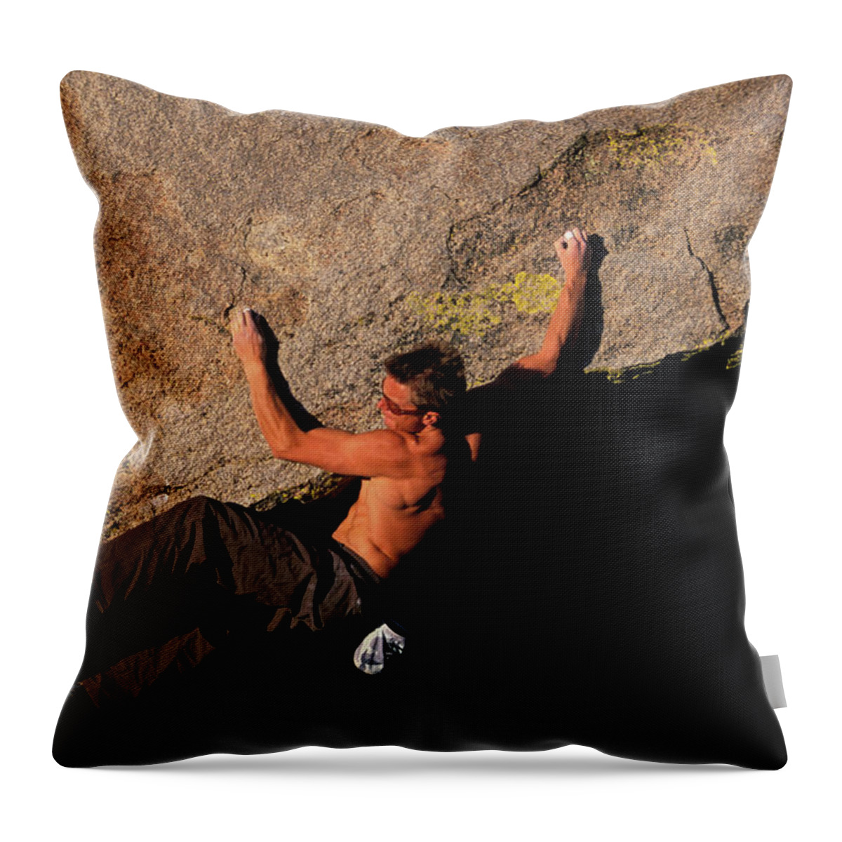 Action Throw Pillow featuring the photograph A Male Rock Climber Bouldering On An by Corey Rich