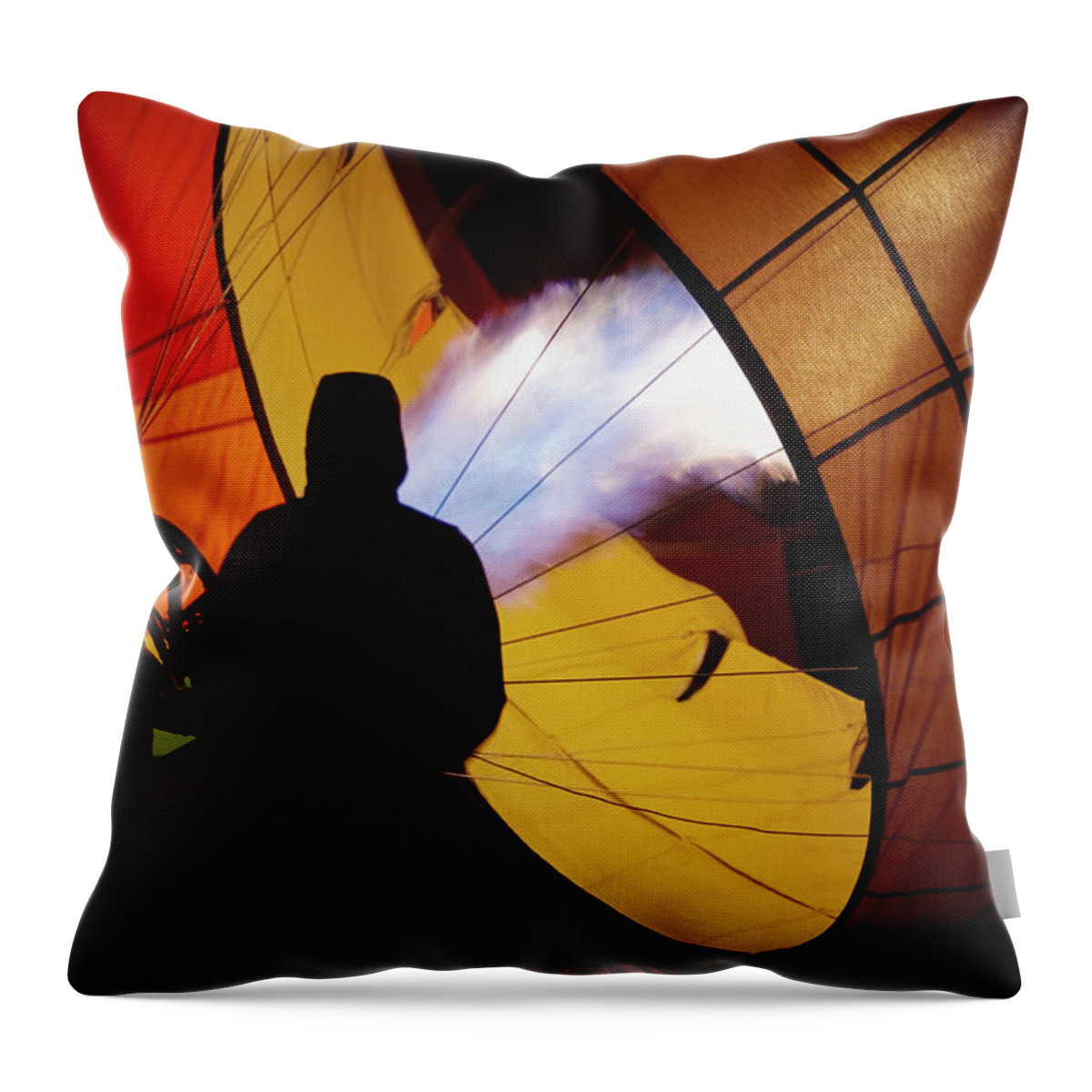 Adventure Throw Pillow featuring the photograph A Man As He Inflates A Hot Air Balloon by Ron Koeberer