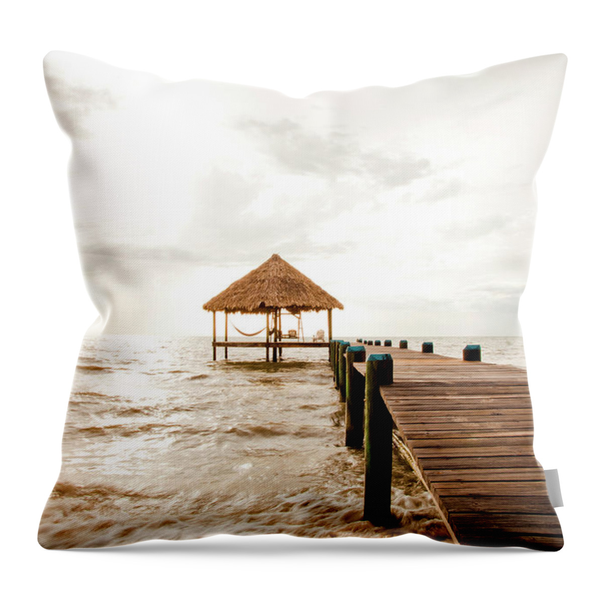 Tranquility Throw Pillow featuring the photograph A Serene Dock And Cabana At Sunrise by Adam Hester