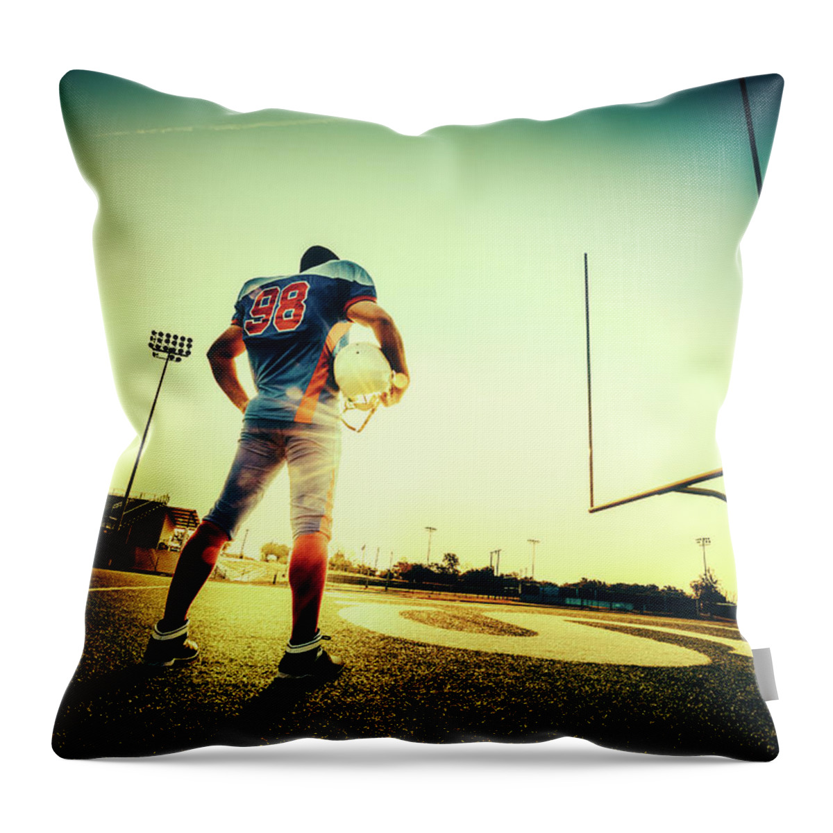 Headwear Throw Pillow featuring the photograph American Football Player by Ferrantraite