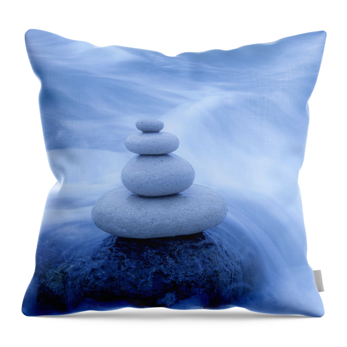 Tranquility Throw Pillow featuring the photograph Balanced Stones On The Beach by Travelpix Ltd