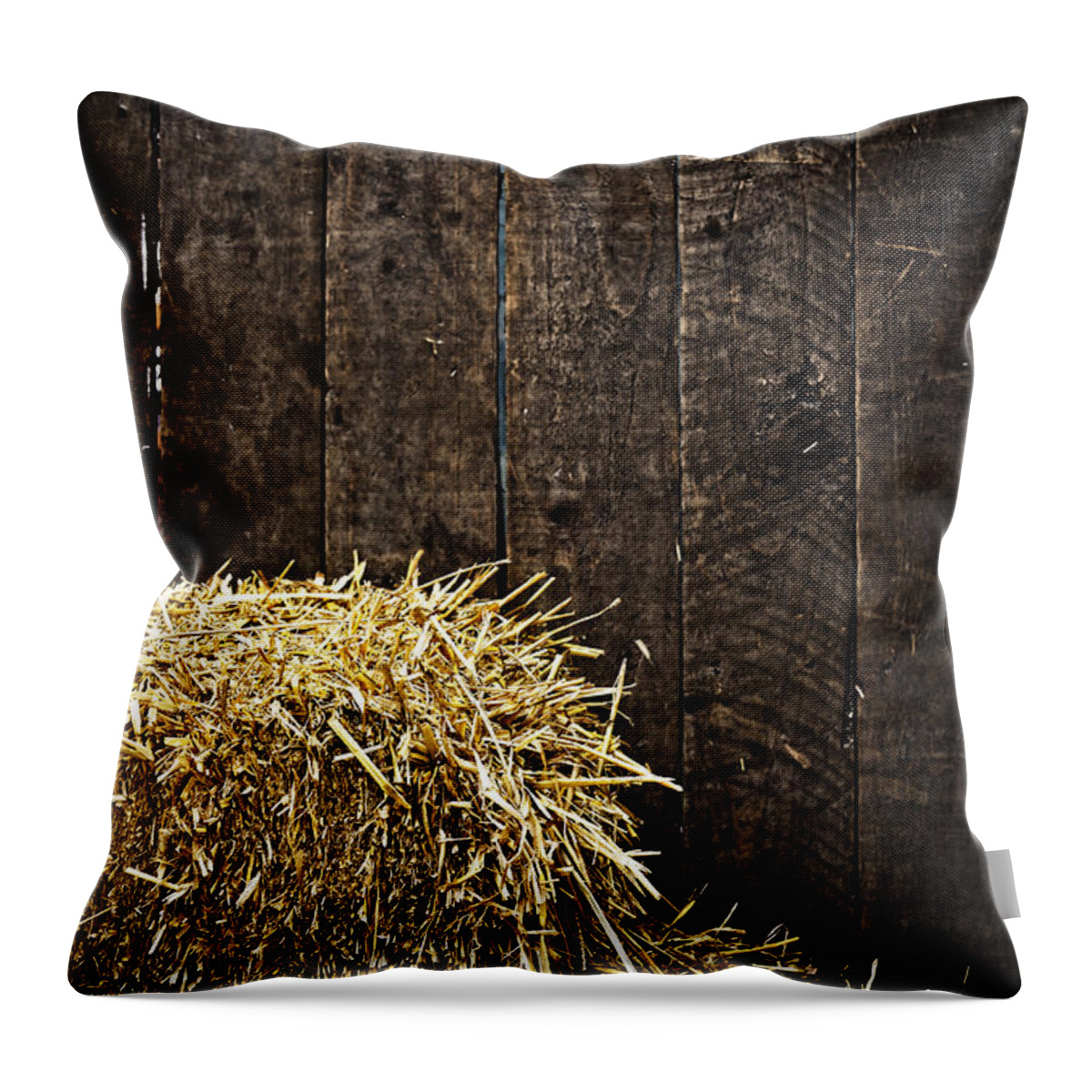 Straw Throw Pillow featuring the photograph Bale of straw and wooden background by Dutourdumonde Photography
