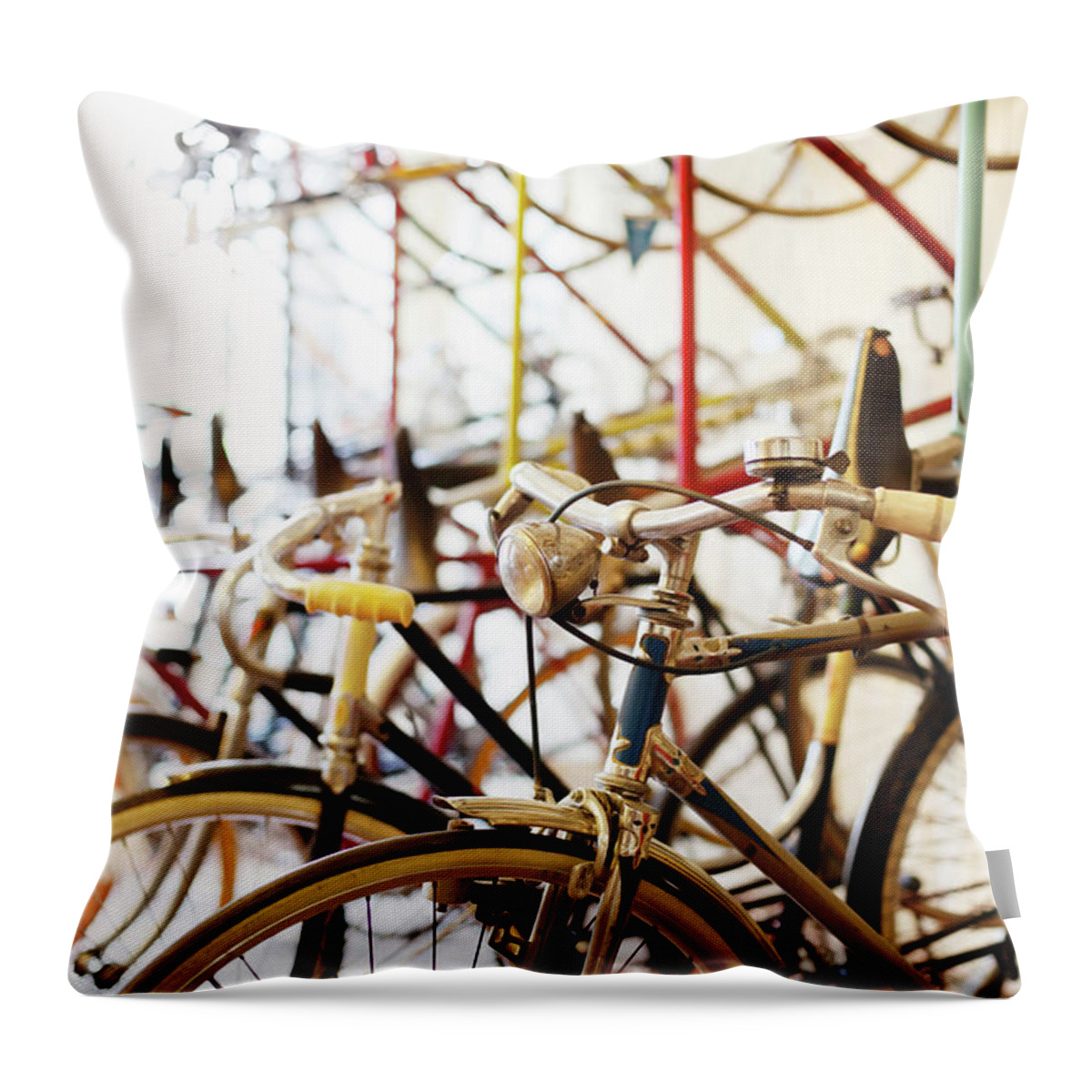Berlin Throw Pillow featuring the photograph Bicycles Parked In A Bike Shop by Alvarez