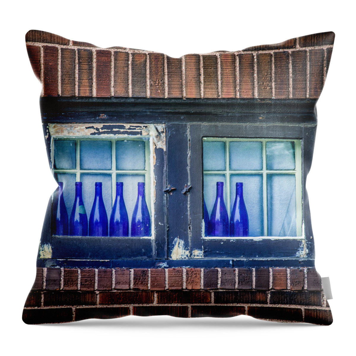 Bottles Throw Pillow featuring the photograph Blue Bottles In A Window by Paul Freidlund