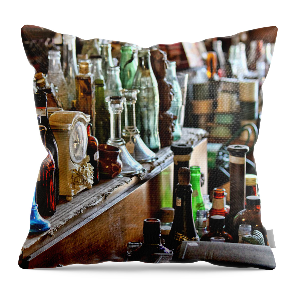 Old Bottles Throw Pillow featuring the photograph Bottles in the Old Stuff Shop by Lynn Jordan