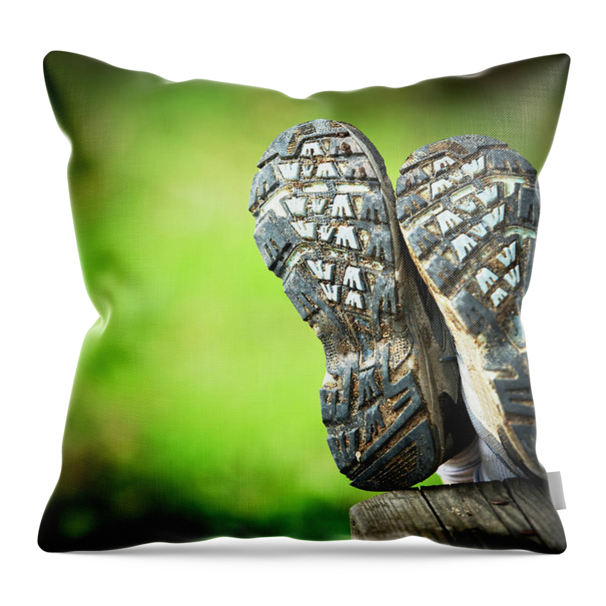 Alone Throw Pillow featuring the photograph Bottom View Of Hiking Shoes by Ron Koeberer