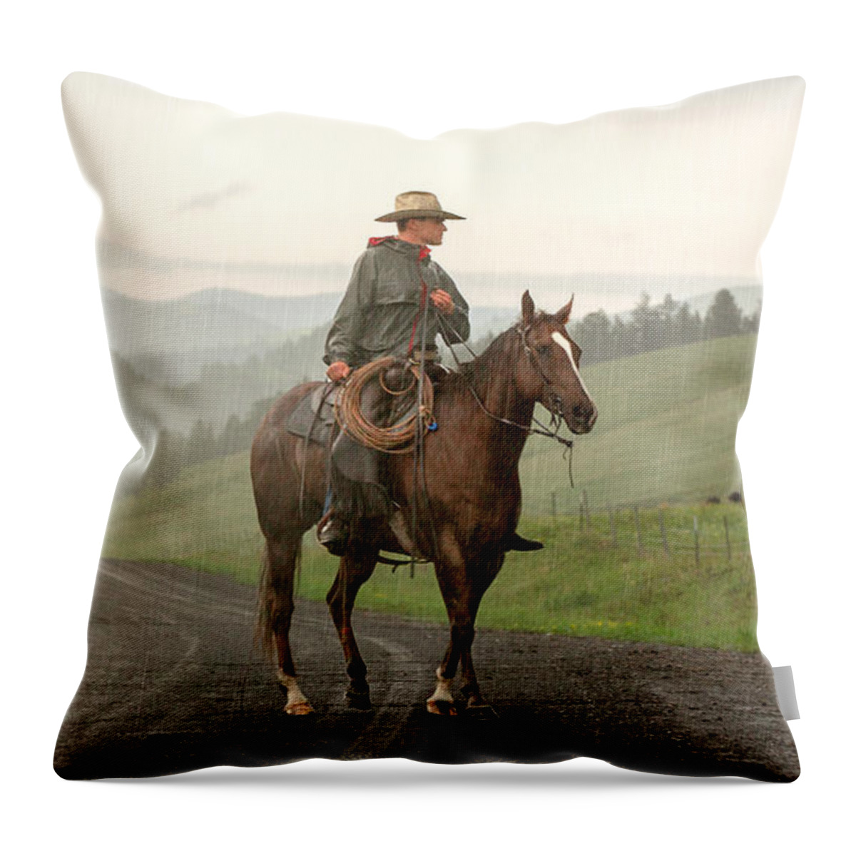 Cowboy Throw Pillow featuring the photograph Braving the Rain by Todd Klassy