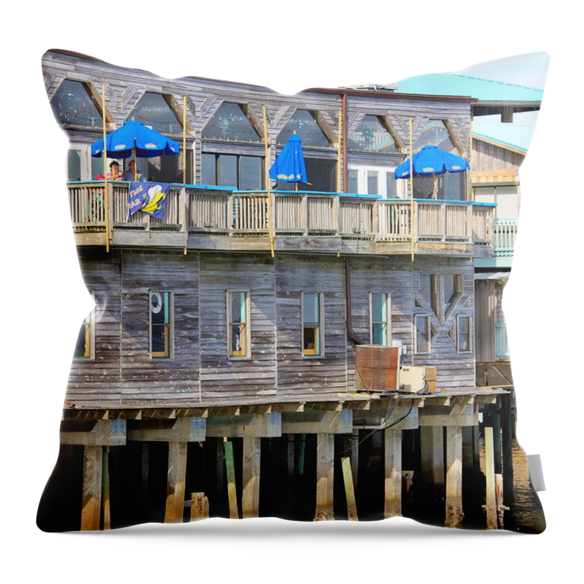Restaurant Along The Sea Throw Pillow featuring the photograph Building on Piles Above Water by Lorna Maza