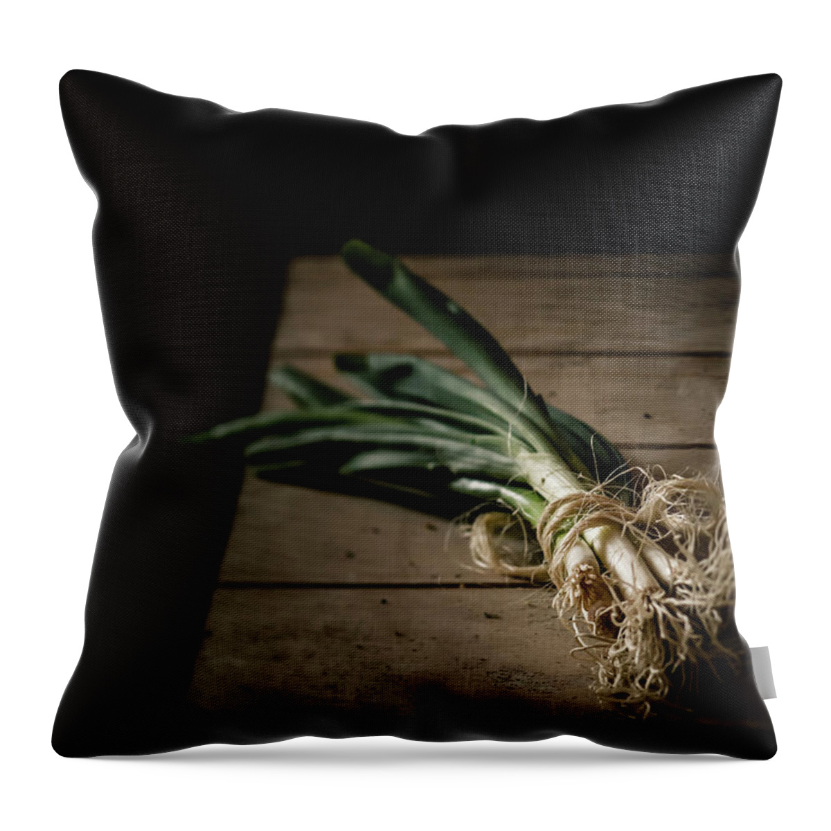 Black Background Throw Pillow featuring the photograph Bunch Of Spring Onions Tied With by Westend61