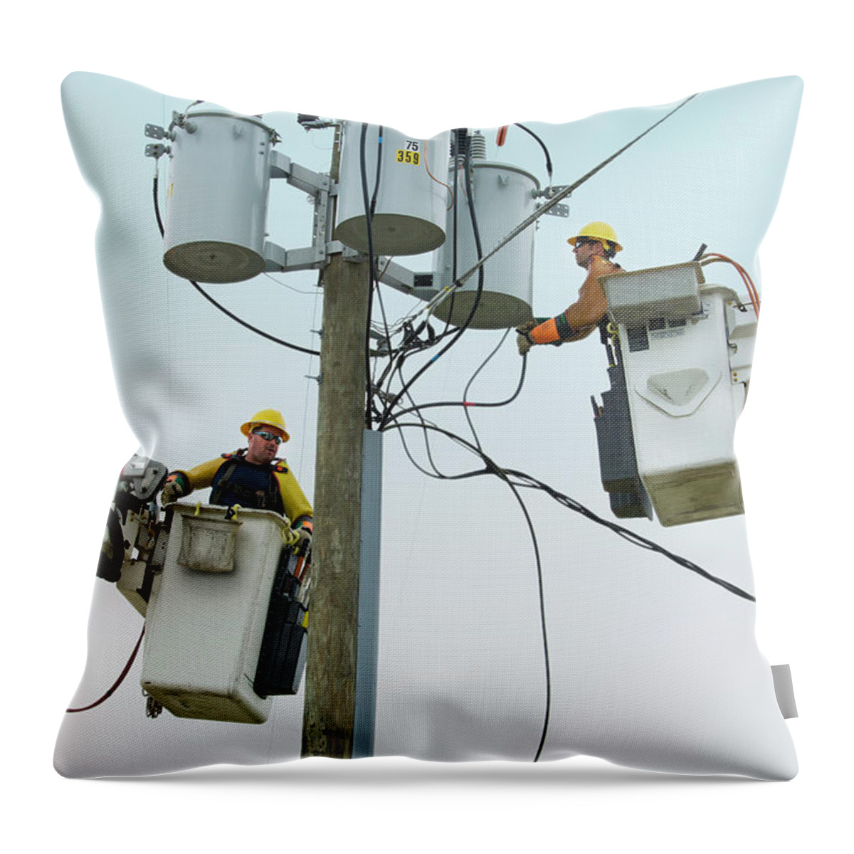 Working Throw Pillow featuring the photograph Caucasian Workers In Cherry Pickers by Ariel Skelley