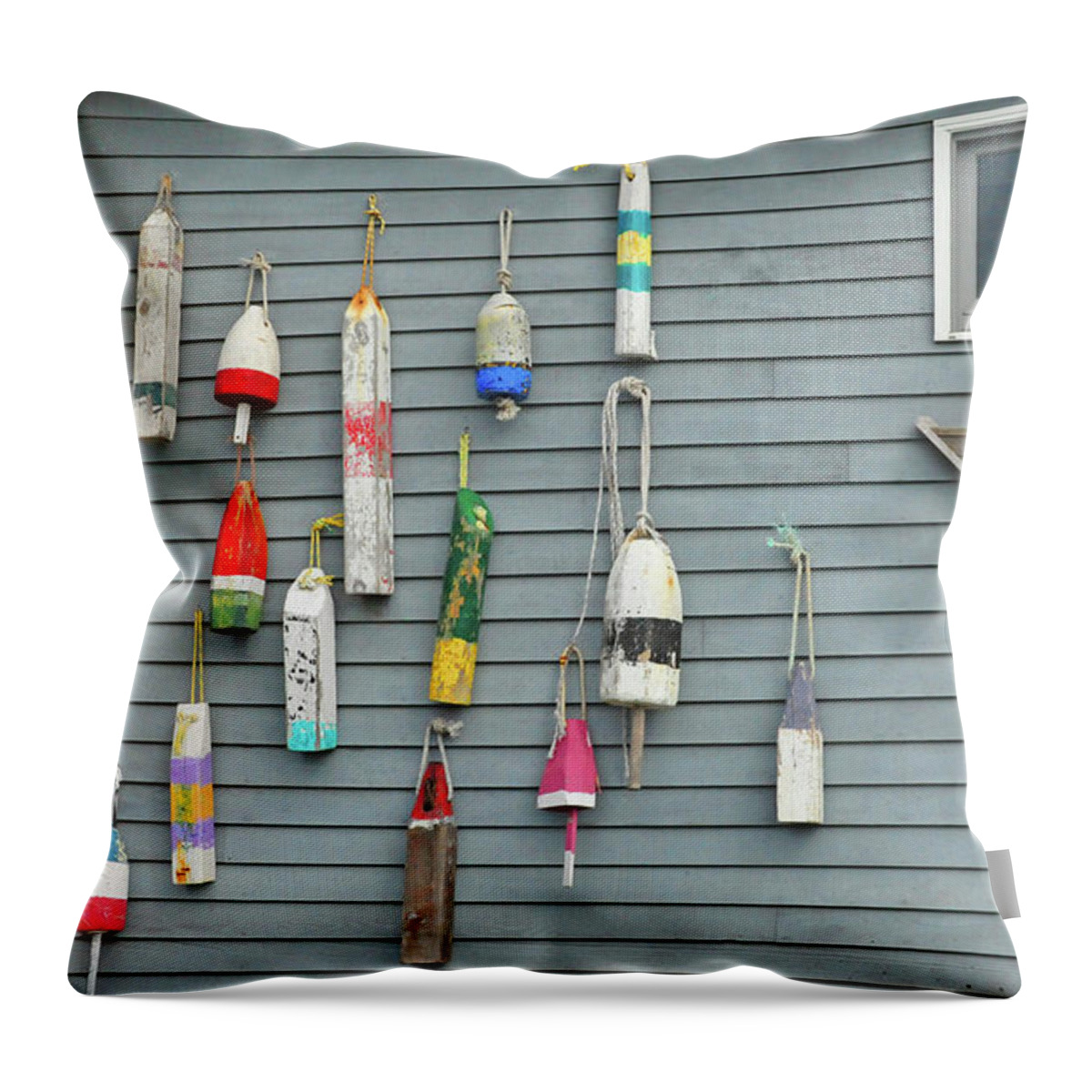 Hanging Throw Pillow featuring the photograph Colorful Buoys Hanging On Side Of House by Heather Paul