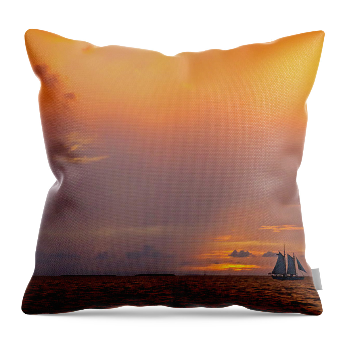 Key West Throw Pillow featuring the photograph Dramatic Sunset with sailing ship off the isle of Key West Florida by Photographic Arts And Design Studio