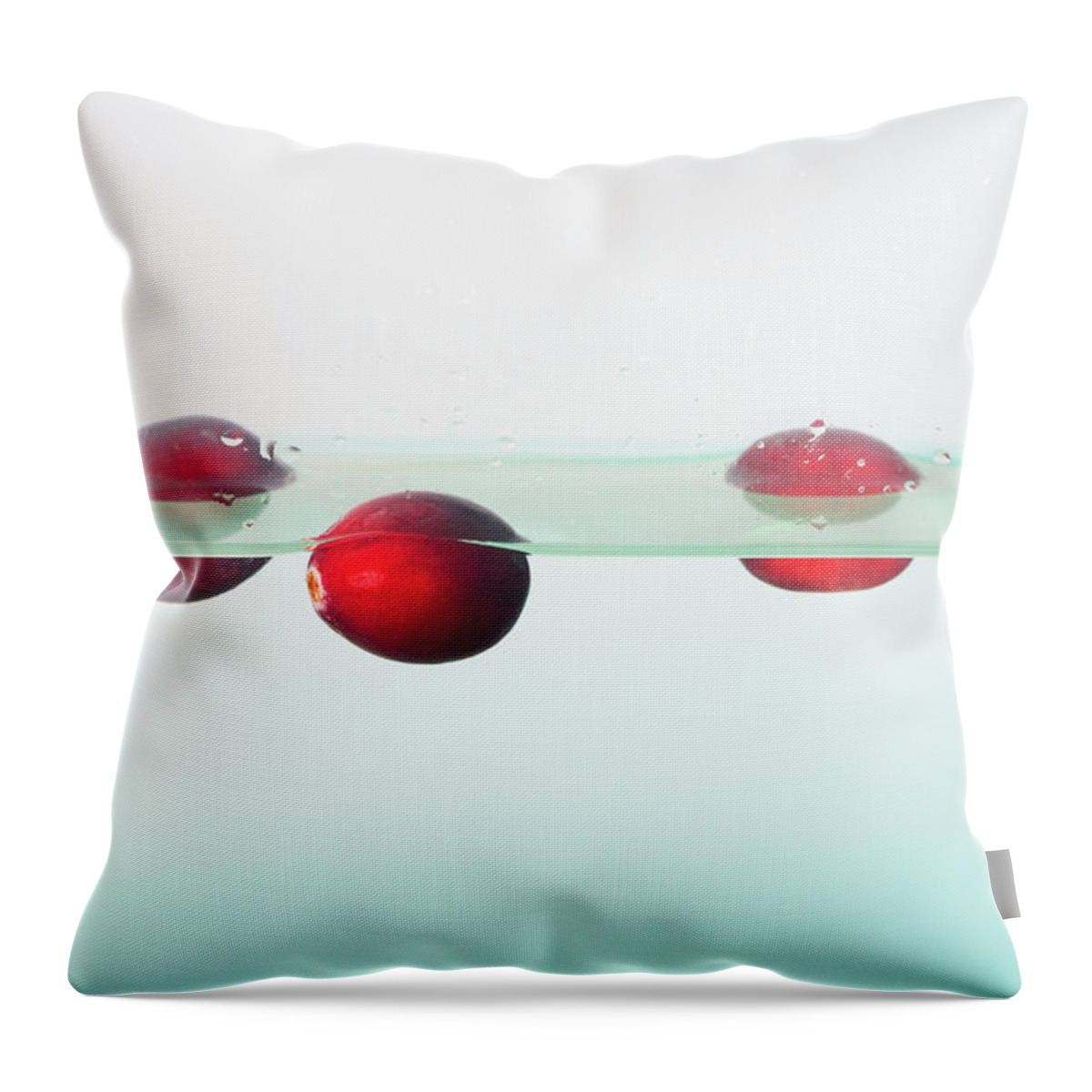 Cranberries Throw Pillow featuring the photograph Floating Cranberries by Diane Macdonald