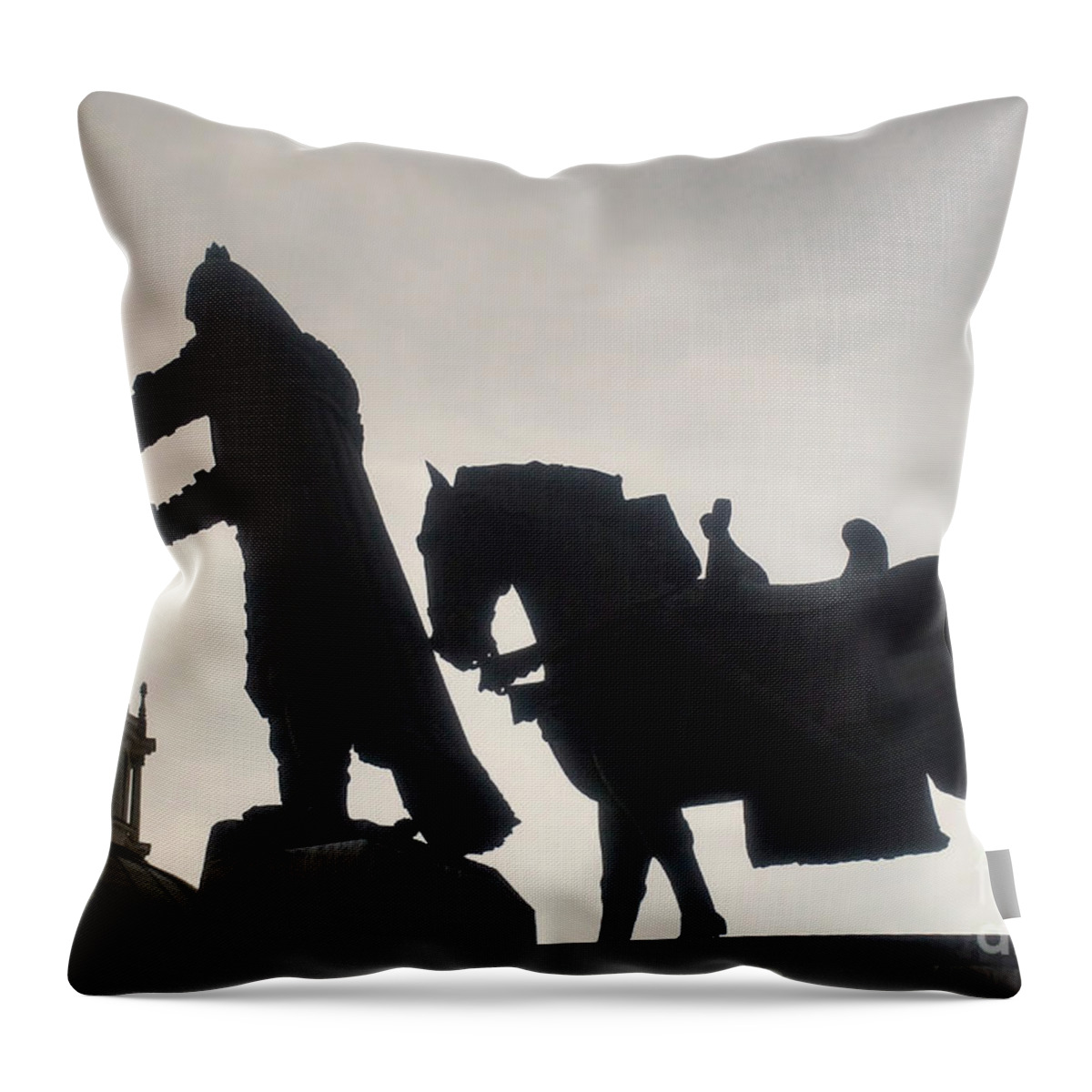 Prott Throw Pillow featuring the photograph Gediminas statue in Vilnius at sunset by Rudi Prott