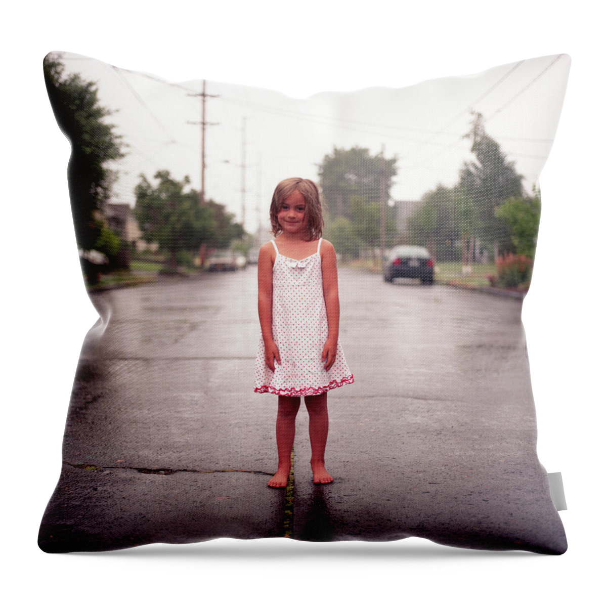 4-5 Years Throw Pillow featuring the photograph Girl In Rainy Street by By John Carleton