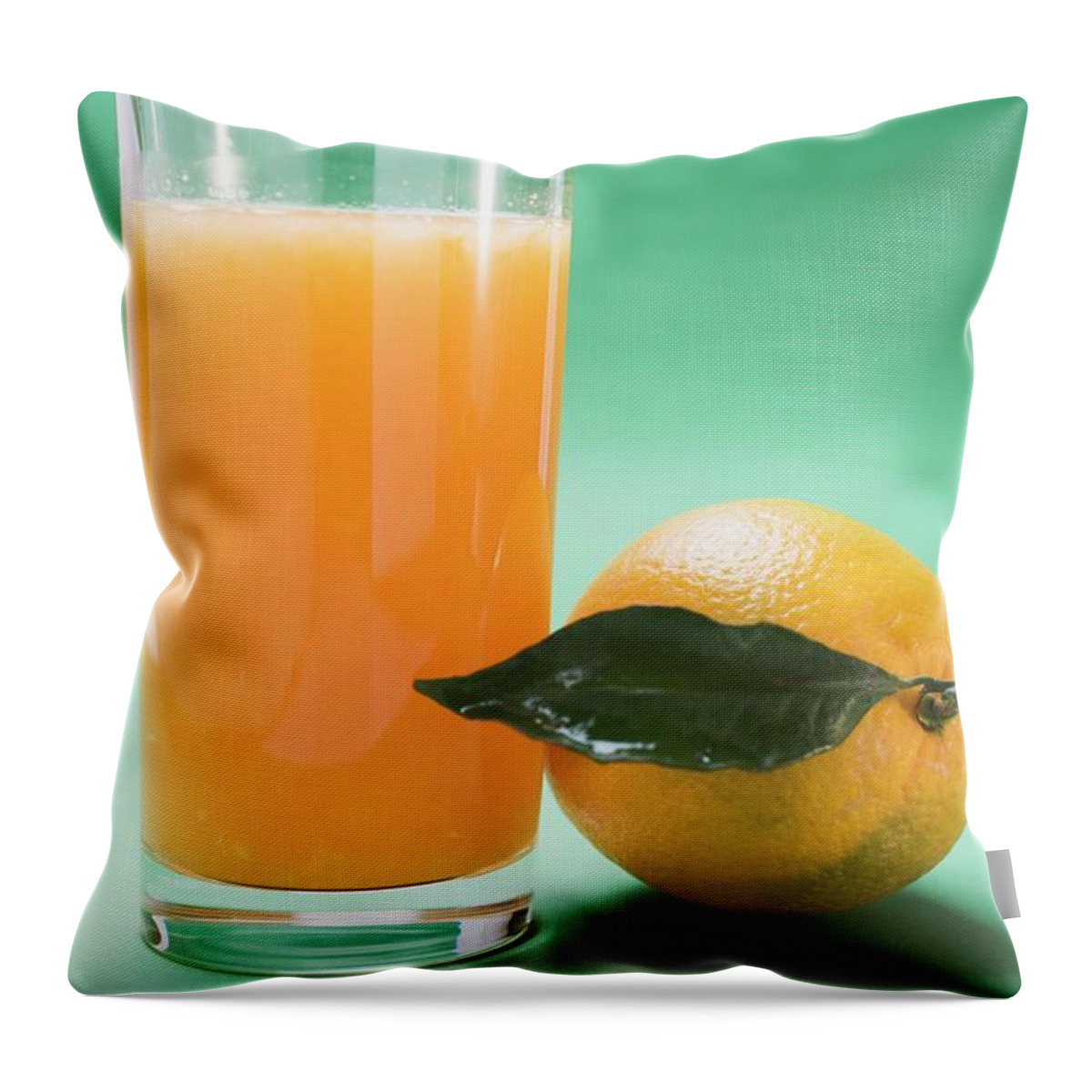 Alcohol Free Throw Pillow featuring the photograph Glass Of Orange Juice Beside Orange With Leaf by Foodcollection