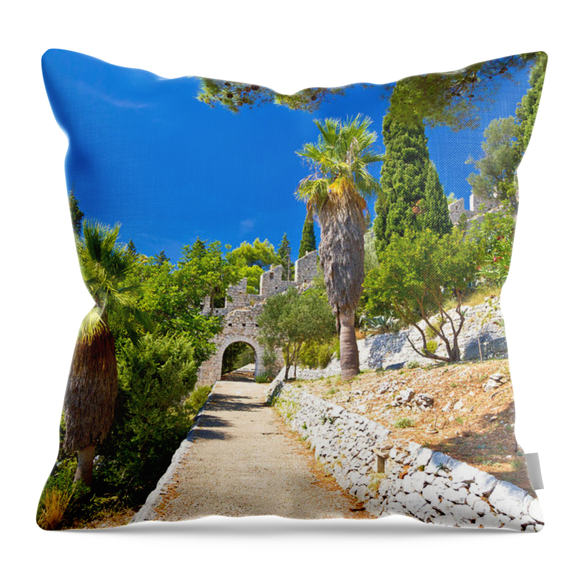 Hvar Throw Pillow featuring the photograph Historic Hvar fortification wall in nature by Brch Photography
