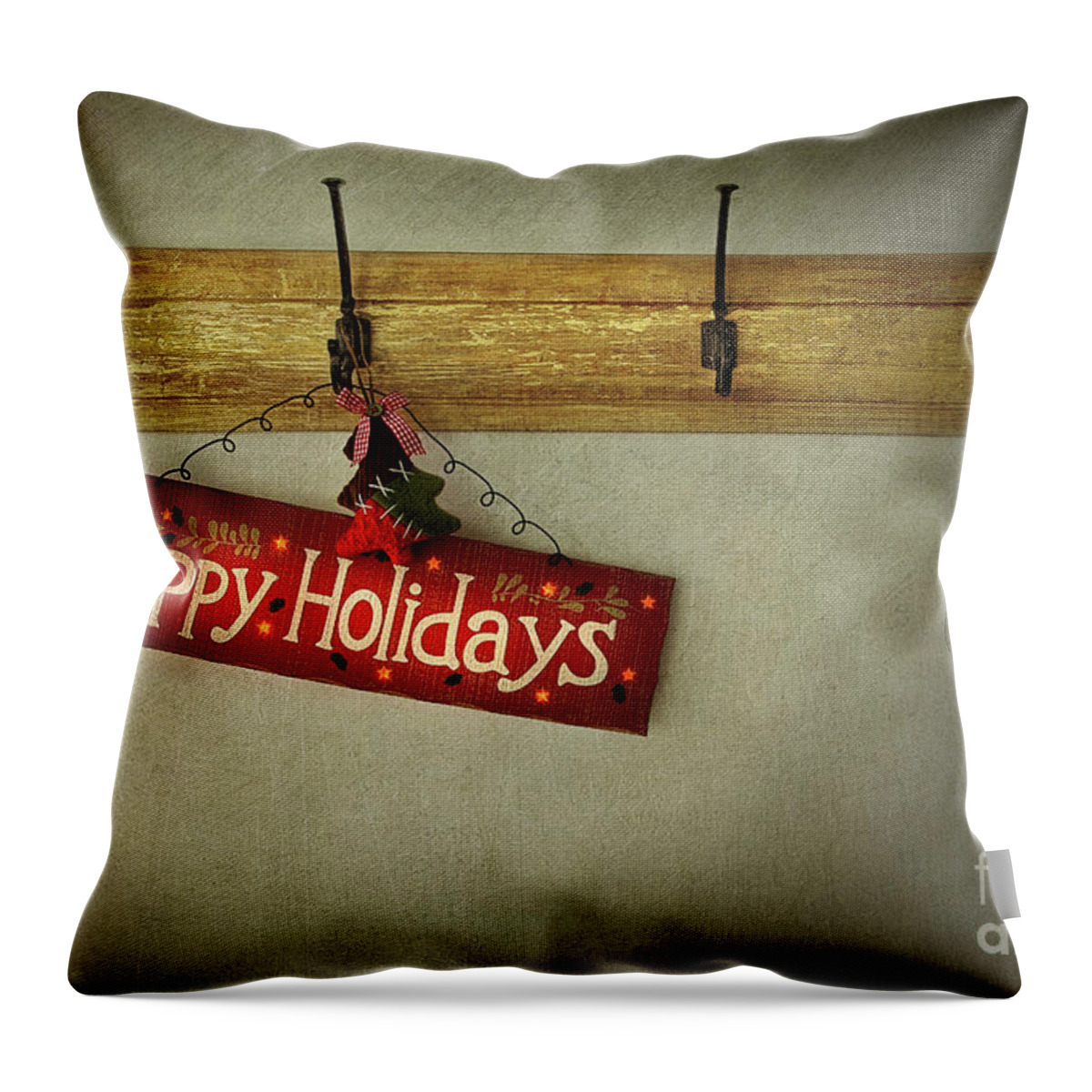 Abstract Throw Pillow featuring the photograph Holiday sign on antique plaster wall by Sandra Cunningham
