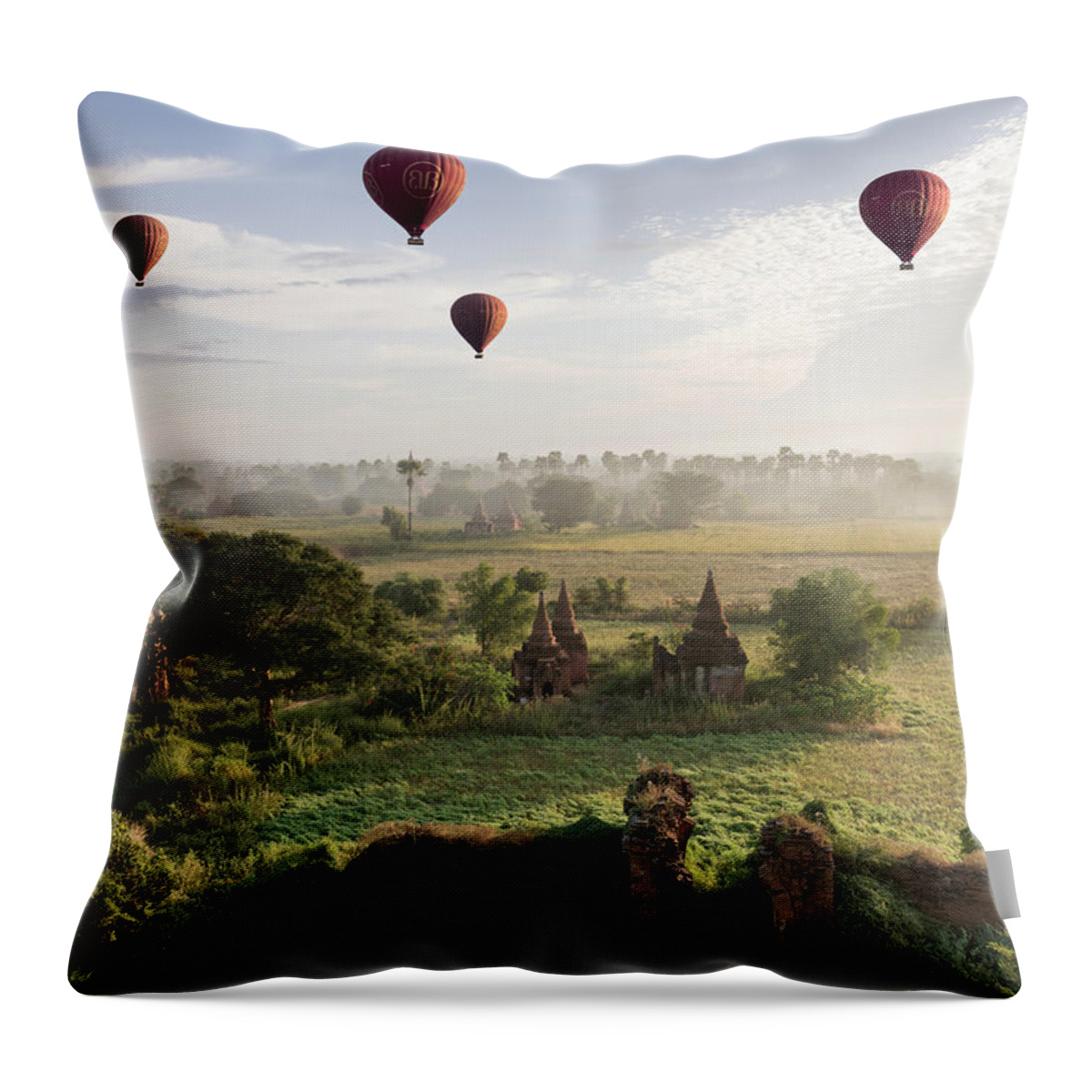 Hot Air Balloon Throw Pillow featuring the photograph Hot Air Balloons Flying Over Ancient by Martin Puddy