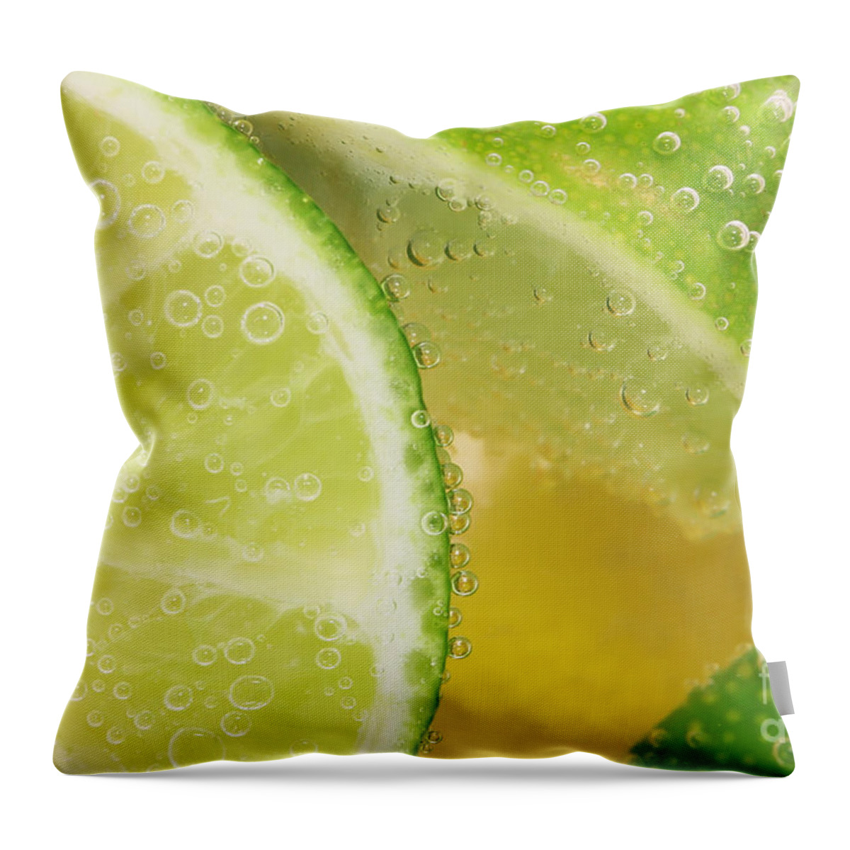 Lemon Throw Pillow featuring the photograph Lemon and lime slices in water by Simon Bratt