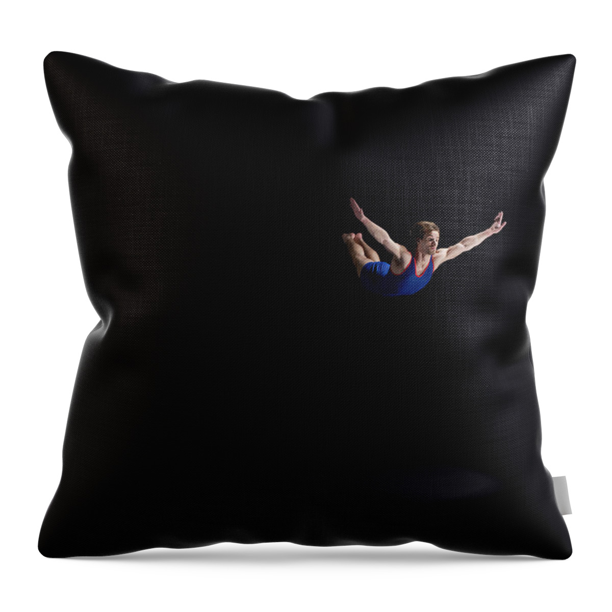 Expertise Throw Pillow featuring the photograph Male Gymnast Soaring Through The Air by Mike Harrington
