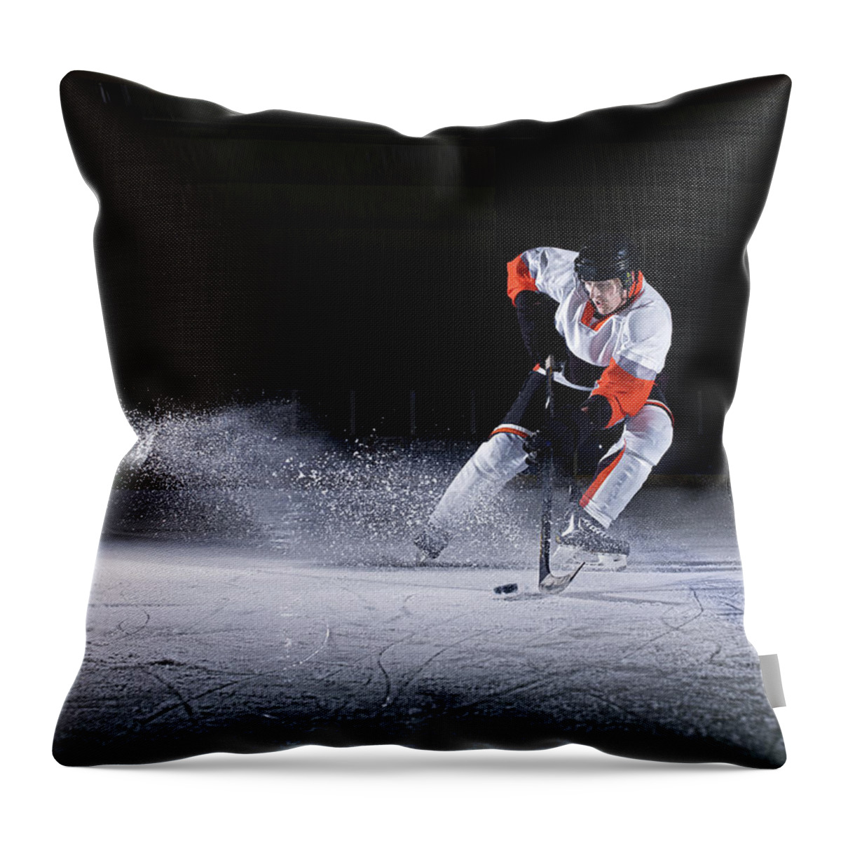 Focus Throw Pillow featuring the photograph Male Ice Hockey Player Taking Puck by Mike Harrington