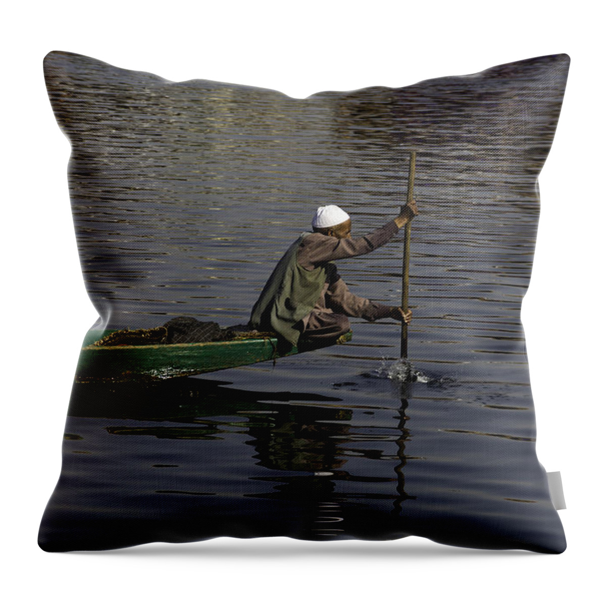 Beautiful Scene Throw Pillow featuring the photograph Man plying a wooden boat on the Dal Lake by Ashish Agarwal