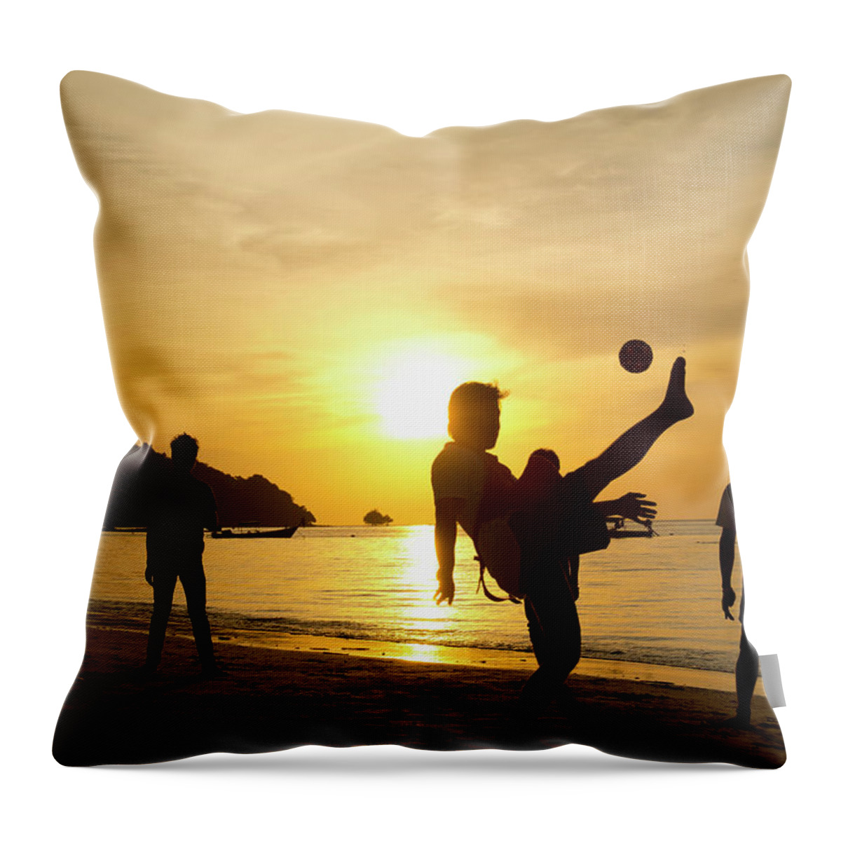Young Men Throw Pillow featuring the photograph Men Playing Takraw Ball At Sunset On by Stuart Corlett / Design Pics