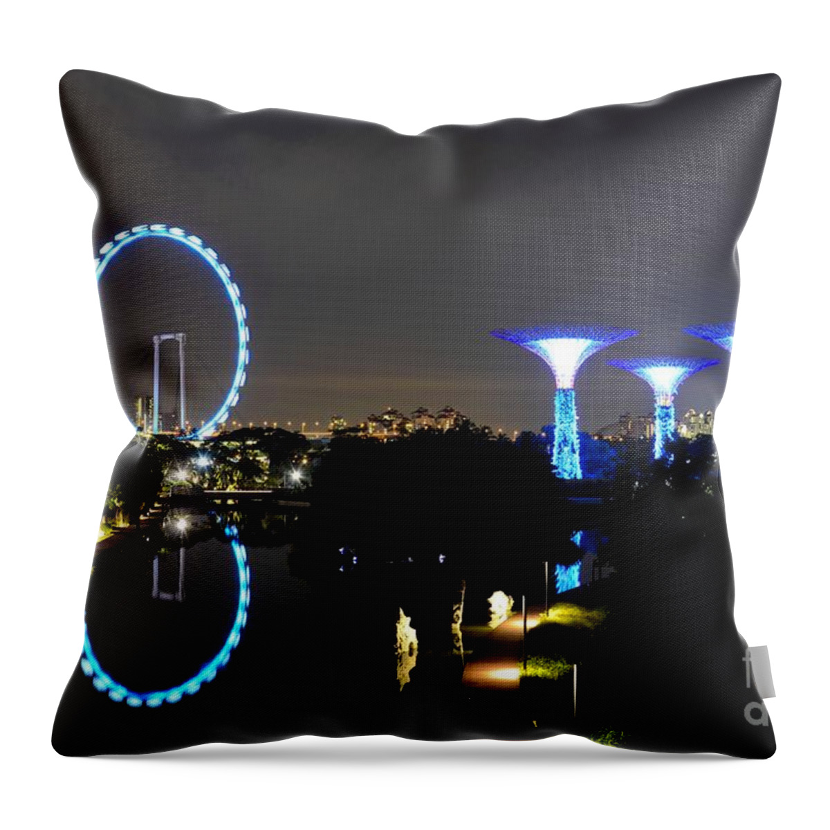 Singapore Throw Pillow featuring the photograph Night shot of Singapore Flyer Gardens by the Bay and water reflections by Imran Ahmed