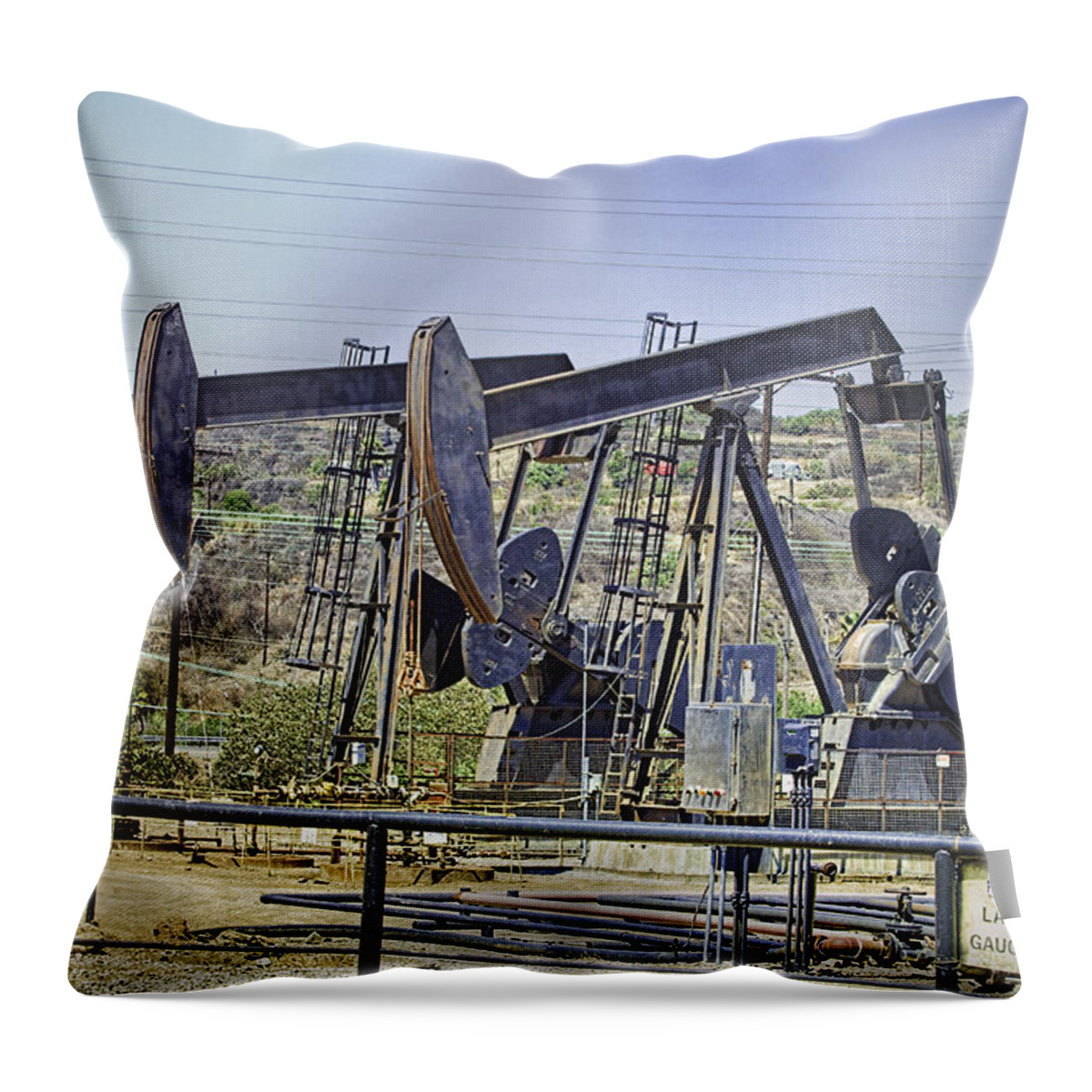 Oil Wells Pumping Throw Pillow featuring the photograph Oil Wells Pumping by Chuck Staley