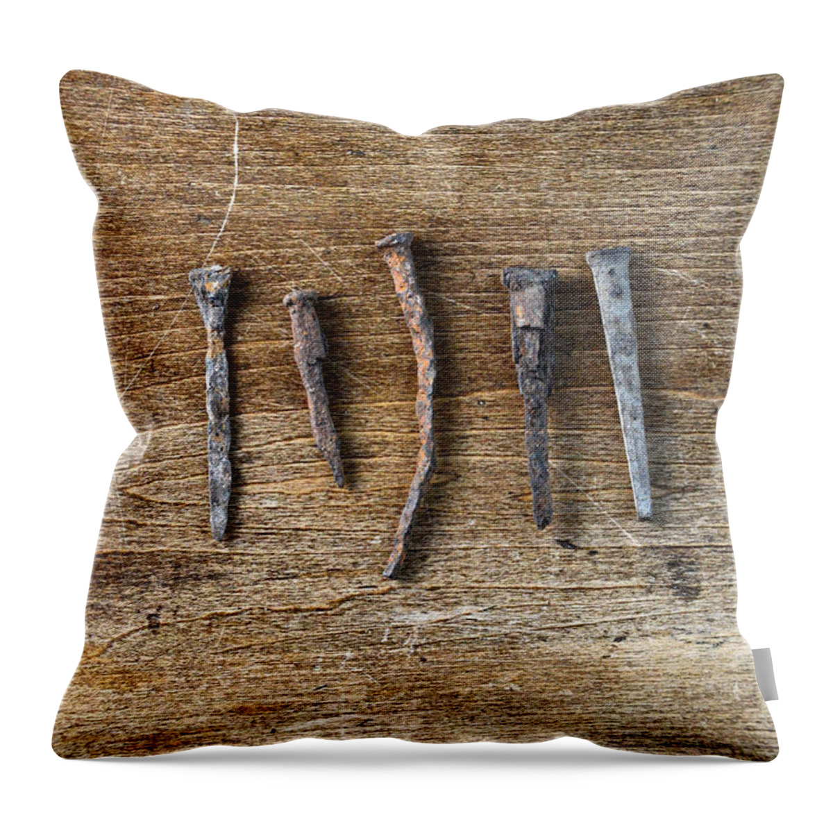 Nail Throw Pillow featuring the photograph Old Nails on a Wooden Table by Jill Battaglia