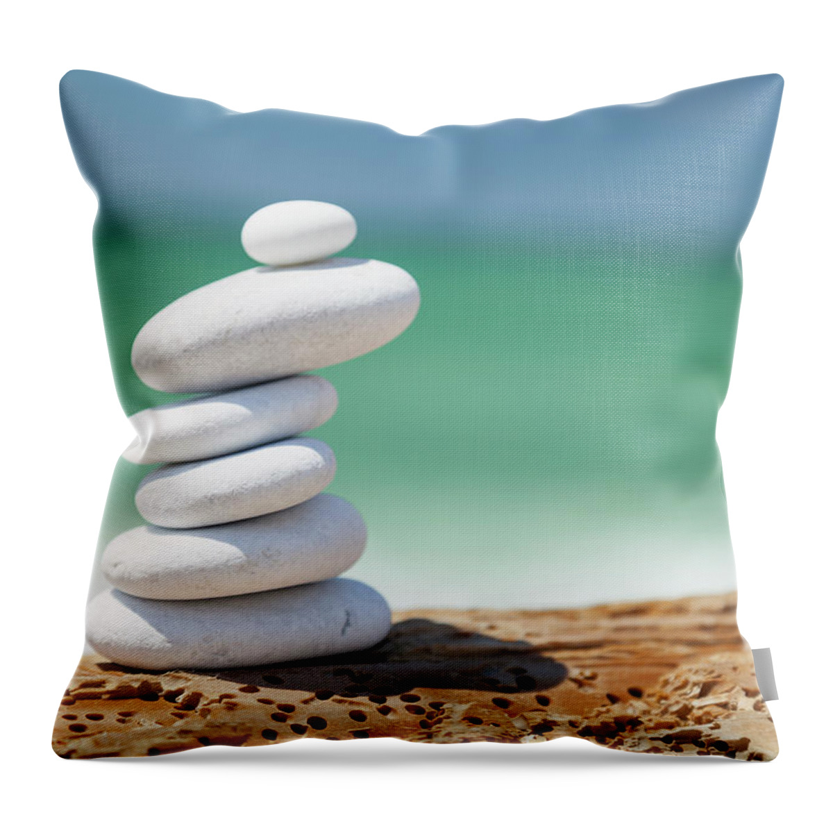 Toughness Throw Pillow featuring the photograph Pebbles At The Beach by Focusstock