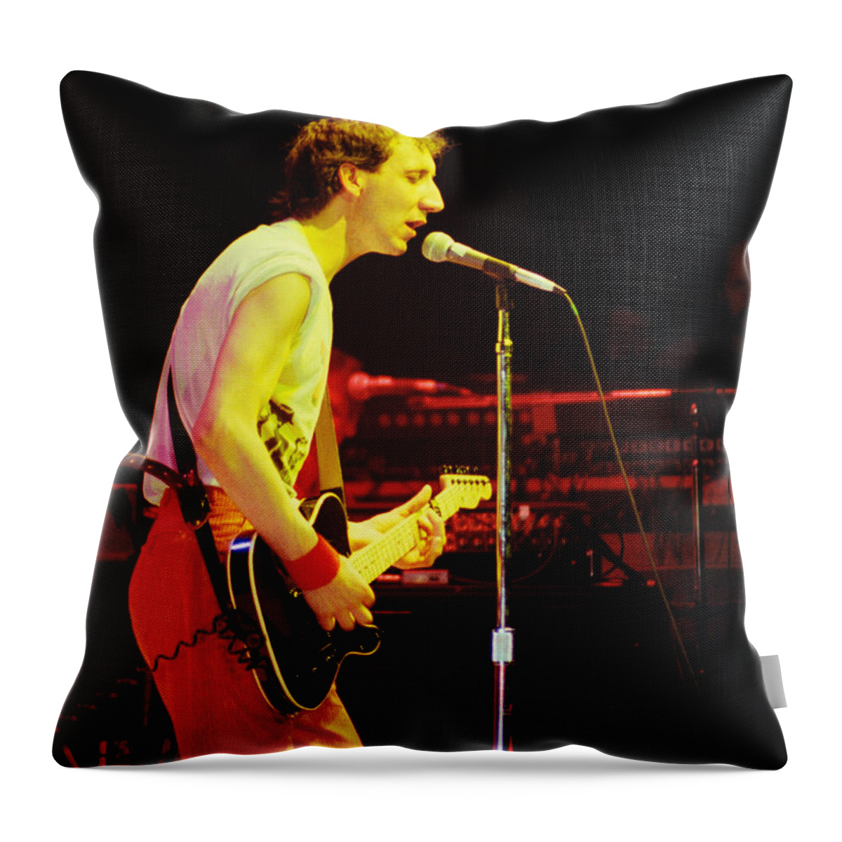 The Who Throw Pillow featuring the photograph Pete Townsend of The Who at Oakland CA 1980 by Daniel Larsen