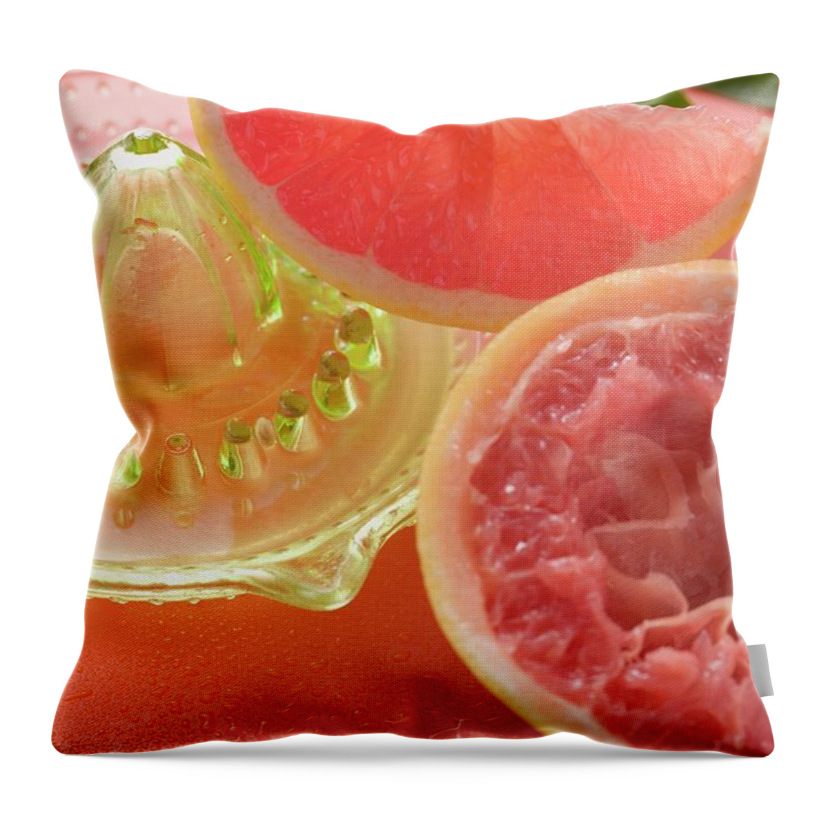 Being Squeezed Throw Pillow featuring the photograph Pink Grapefruit Wedge, Squeezed Grapefruit, Citrus Squeezer by Foodcollection