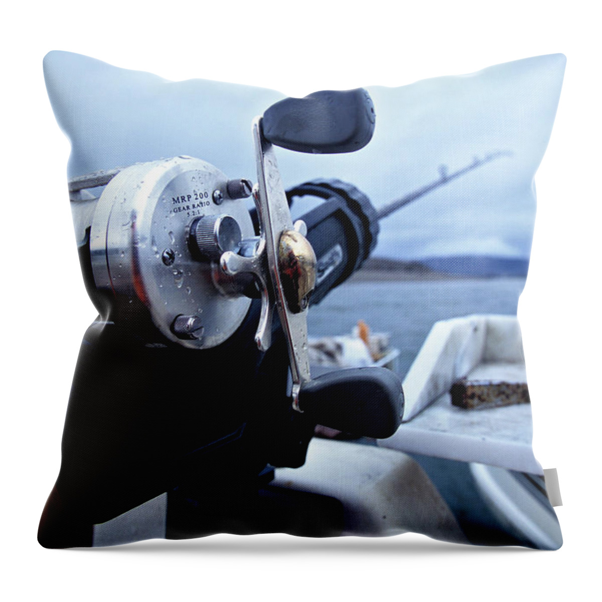 Angling Throw Pillow featuring the photograph Portrait Of Fishing Reel On Boat While by Justin Bailie