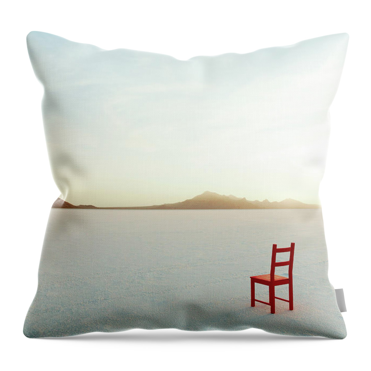 Tranquility Throw Pillow featuring the photograph Red Chair On Salt Flats, Facing The by Andy Ryan