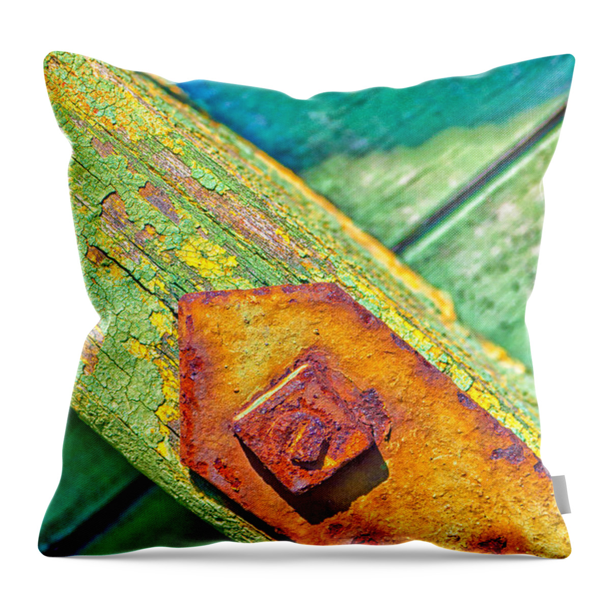 Abstract Throw Pillow featuring the photograph Rusty bolt on rotten green wood by Silvia Ganora